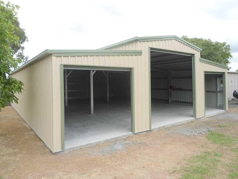 Cream barn-style shed with two open bays and lean-tos